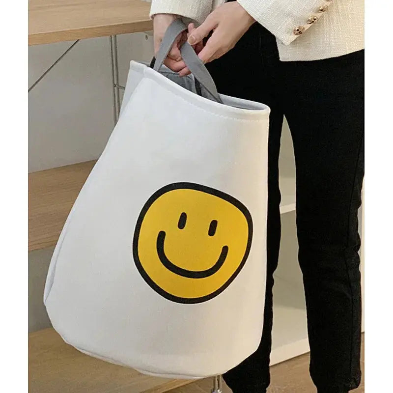 Cesto de Lavanderia de Pano com Alças e Estampa Carinha Feliz Casamarella